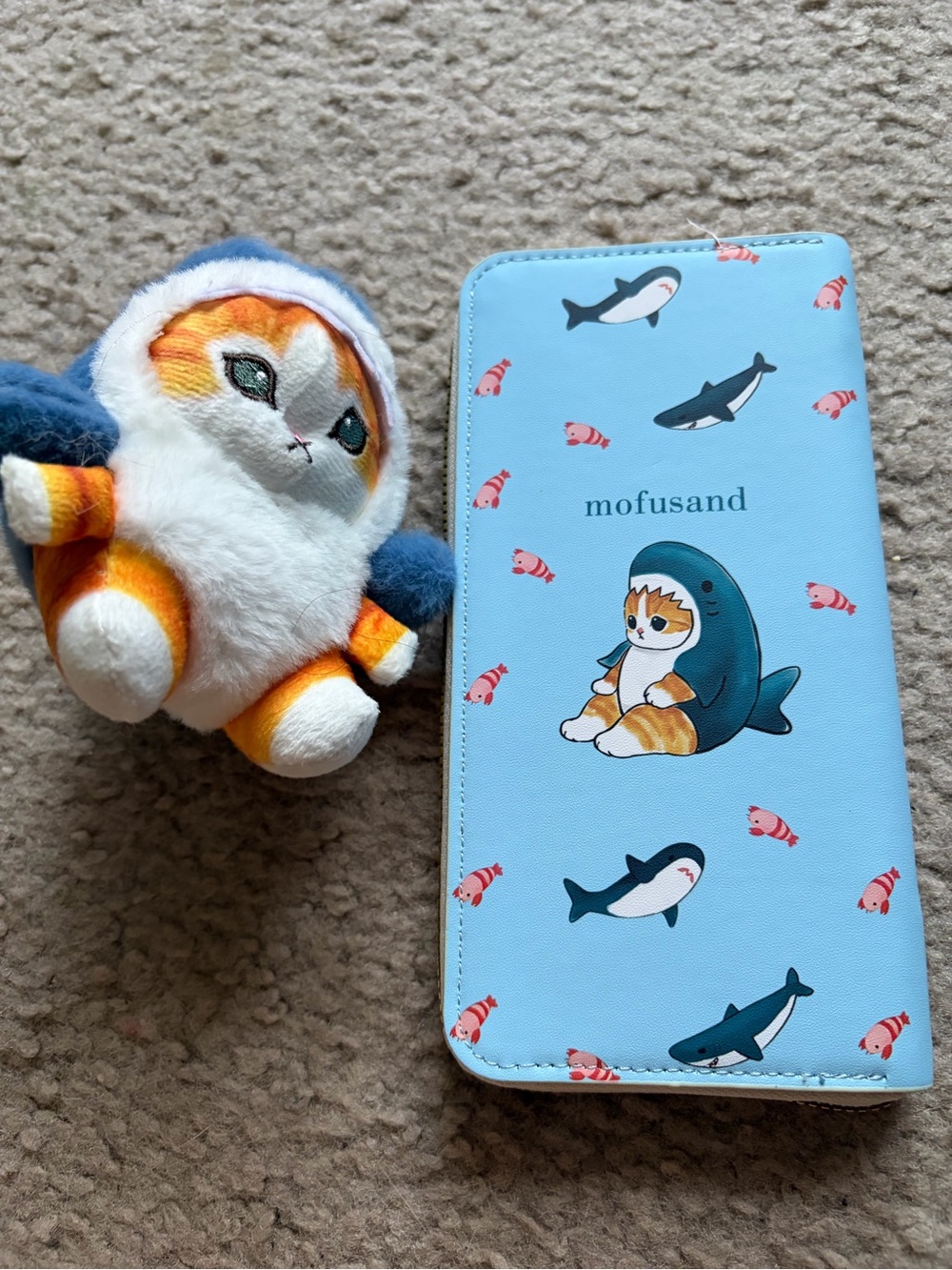 Mofusand shark plush keychain and wallet duo.